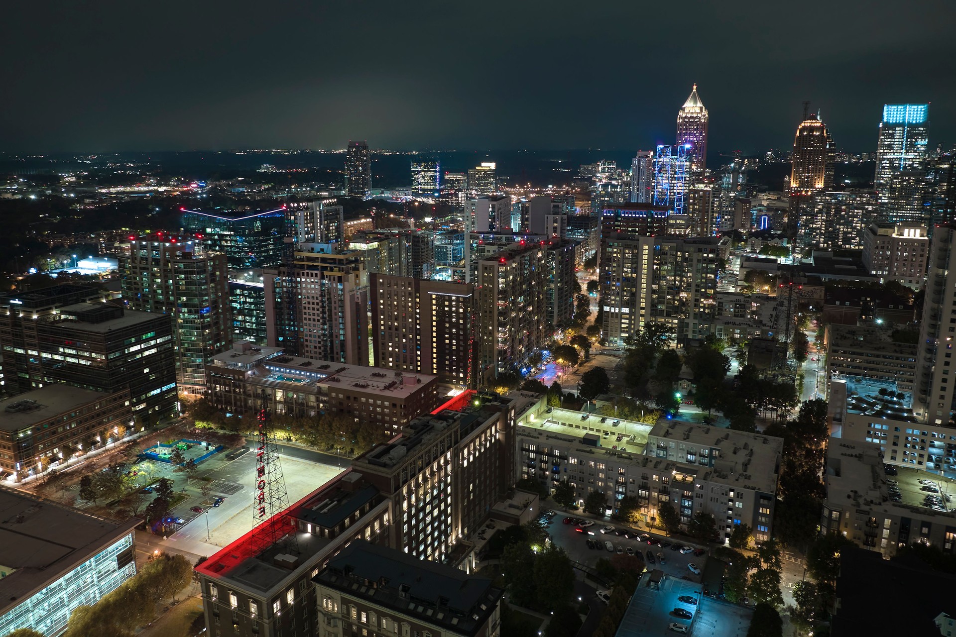 Night urban landscape of downtown district of Atlanta city in Georgia, USA. Skyline with brightly illuminated high skyscraper buildings in modern american megapolis